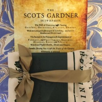 A gift pack containing the Scots Gard'ner book and a tea towel with images and text from the book