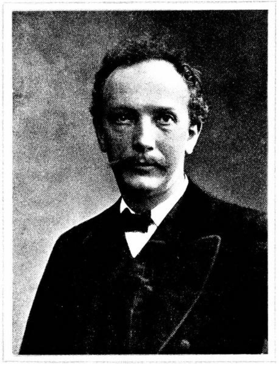 Black and white photograph of James Cuthbert Hadden in a suit and bowtie.